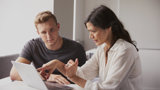 A man and a woman having a meeting