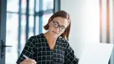 A woman working on a laptop