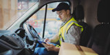 Driver checking his schedule on a tablet