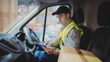 Driver checking his schedule on a tablet