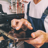 A photo of a worker with a tablet computer