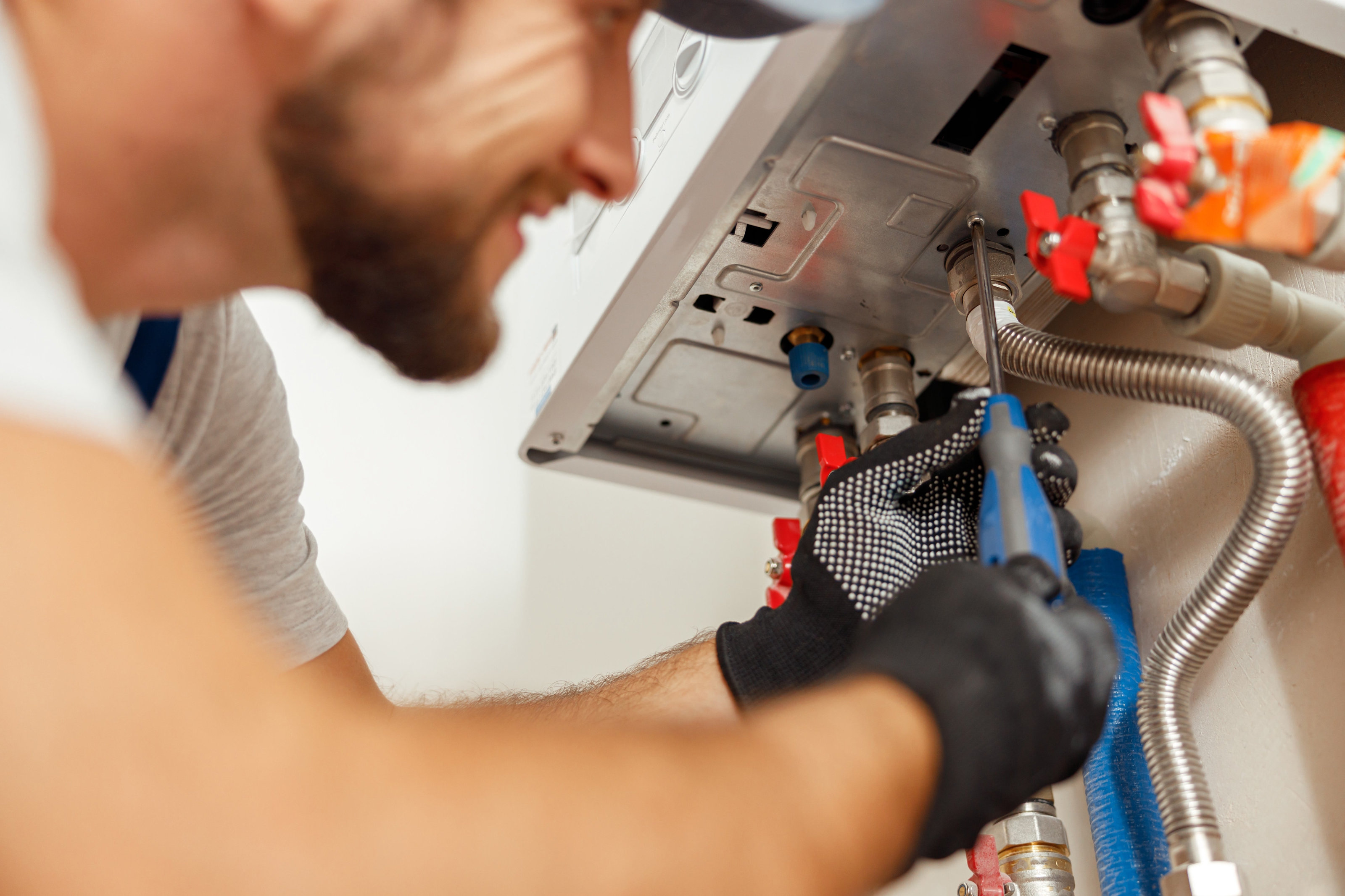 Plumber working on a boiler